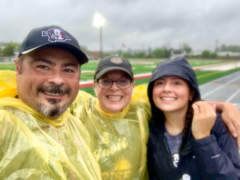 Jose Martinez in a rain poncho at a local 5k in Lake County, Illinois