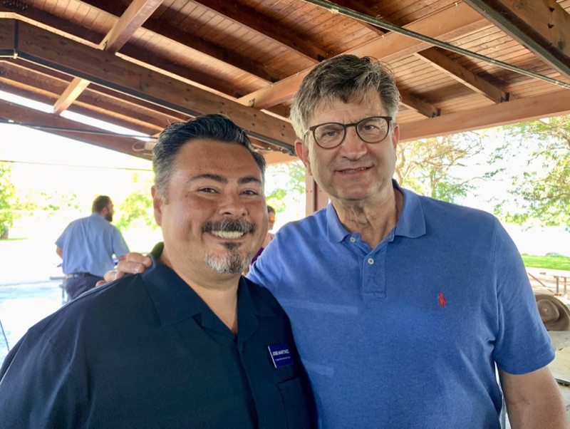 Jose Martinez with Congressman Brad Schneider at a community gathering in Lake County, Illinois