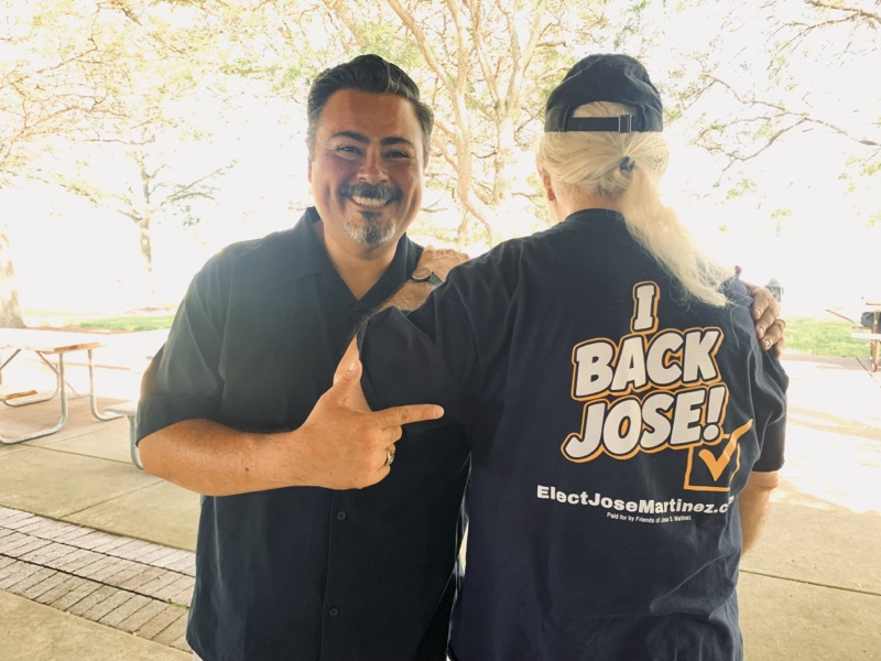 Jose Martinez with a supporter wearing an I Back Jose shirt at a summer campaign fundraiser
