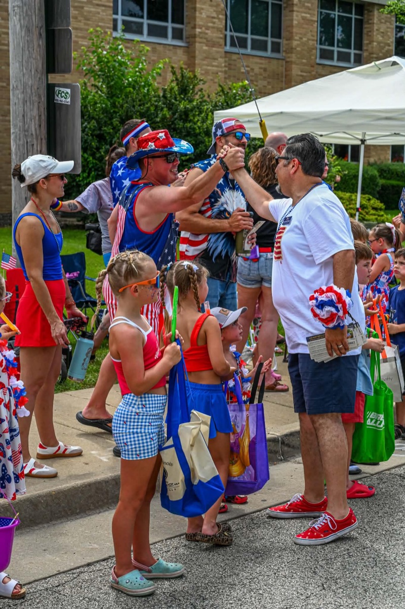 Jose Martinez shaking hands with a supporter at the Antioch 4th of July parade