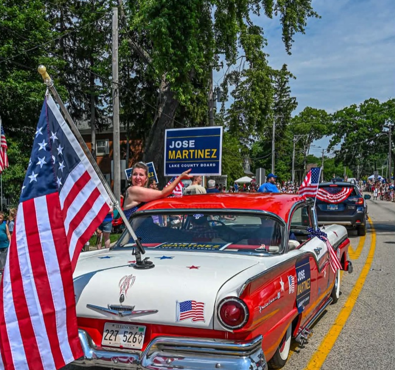 Jose Martinez campaign car with yard signs in the Antioch 4th of July parade